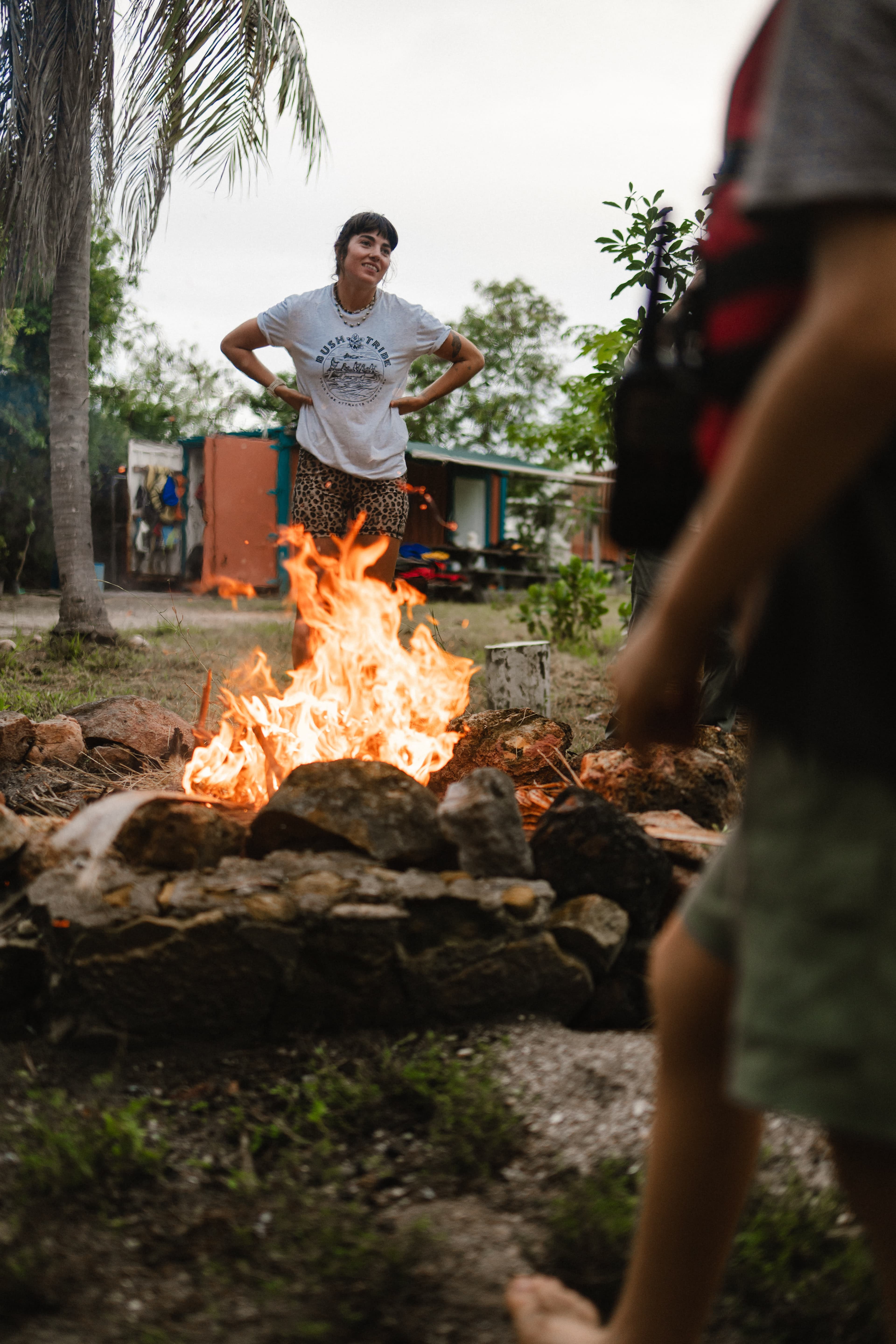 BushTribe guide standing by a campfire on St. Croix